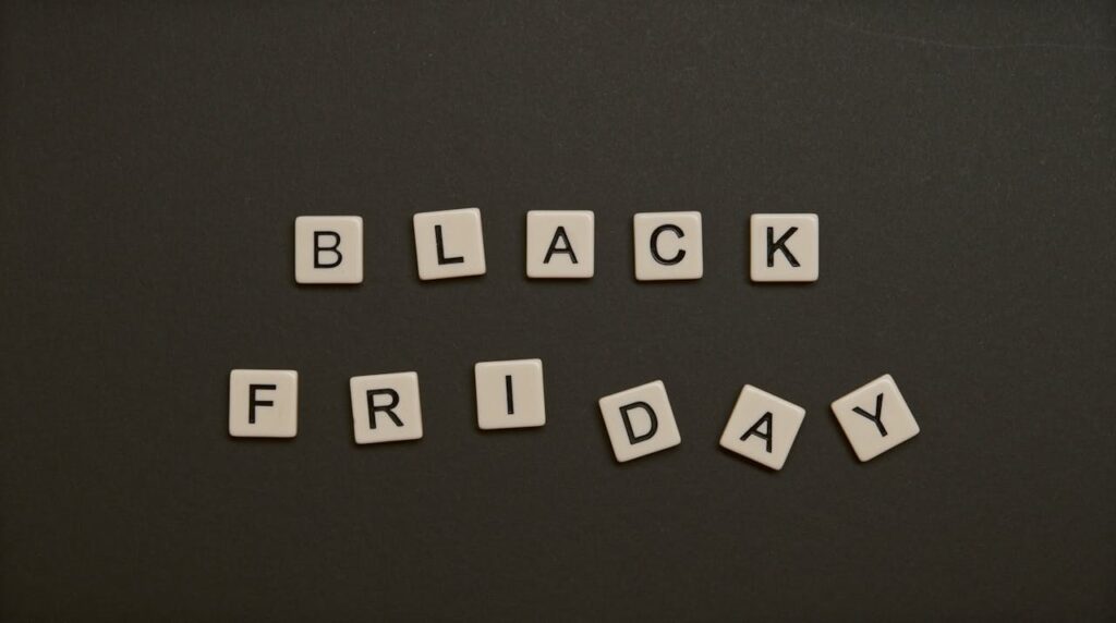 pexels photo 5662852 Black Friday text spelled with letter tiles on a dark flat lay background.